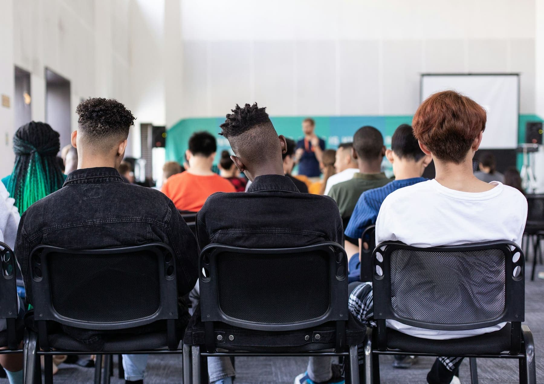Learners seated in a bright training room during a session